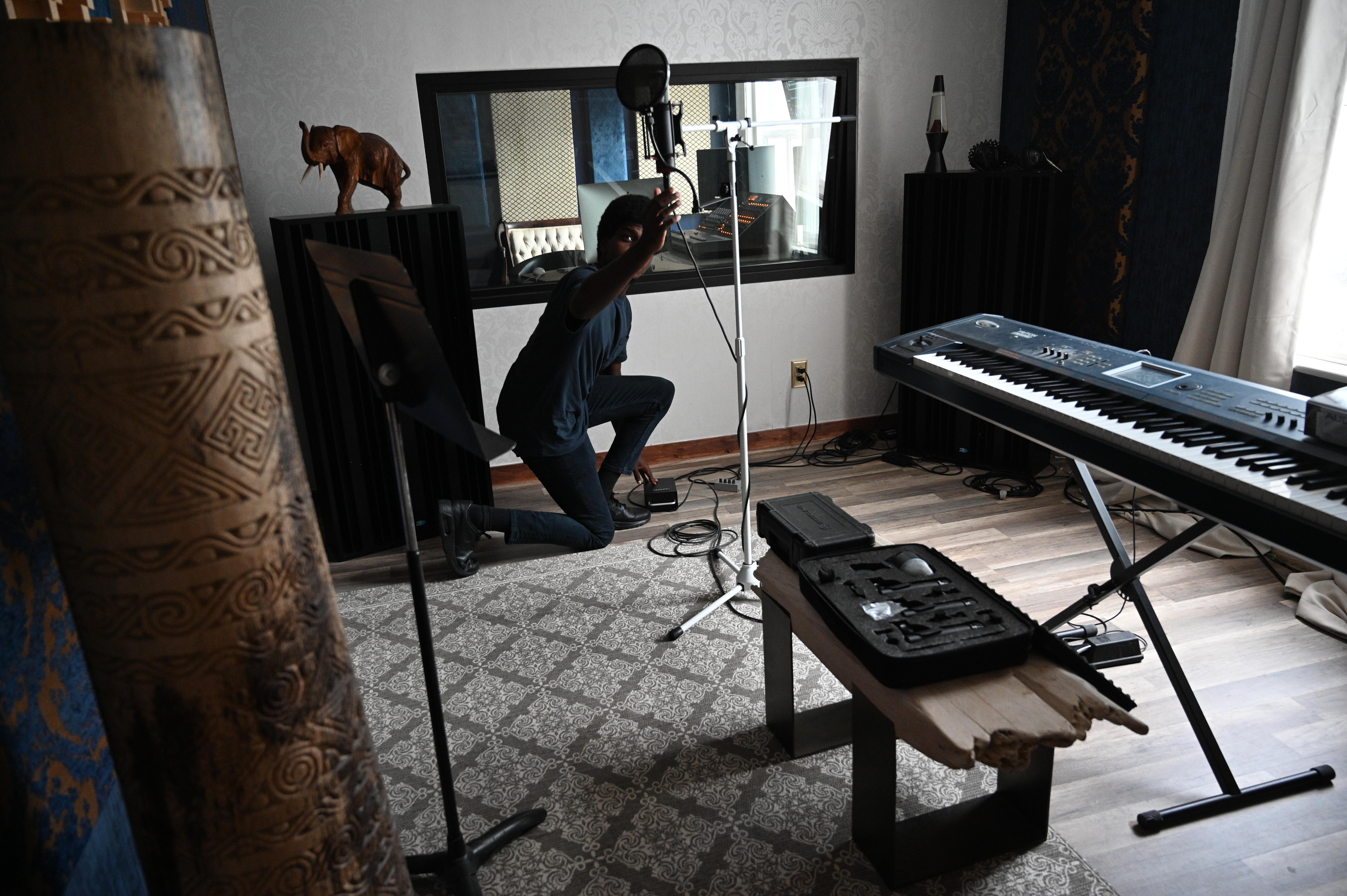 Artist setting a mic up